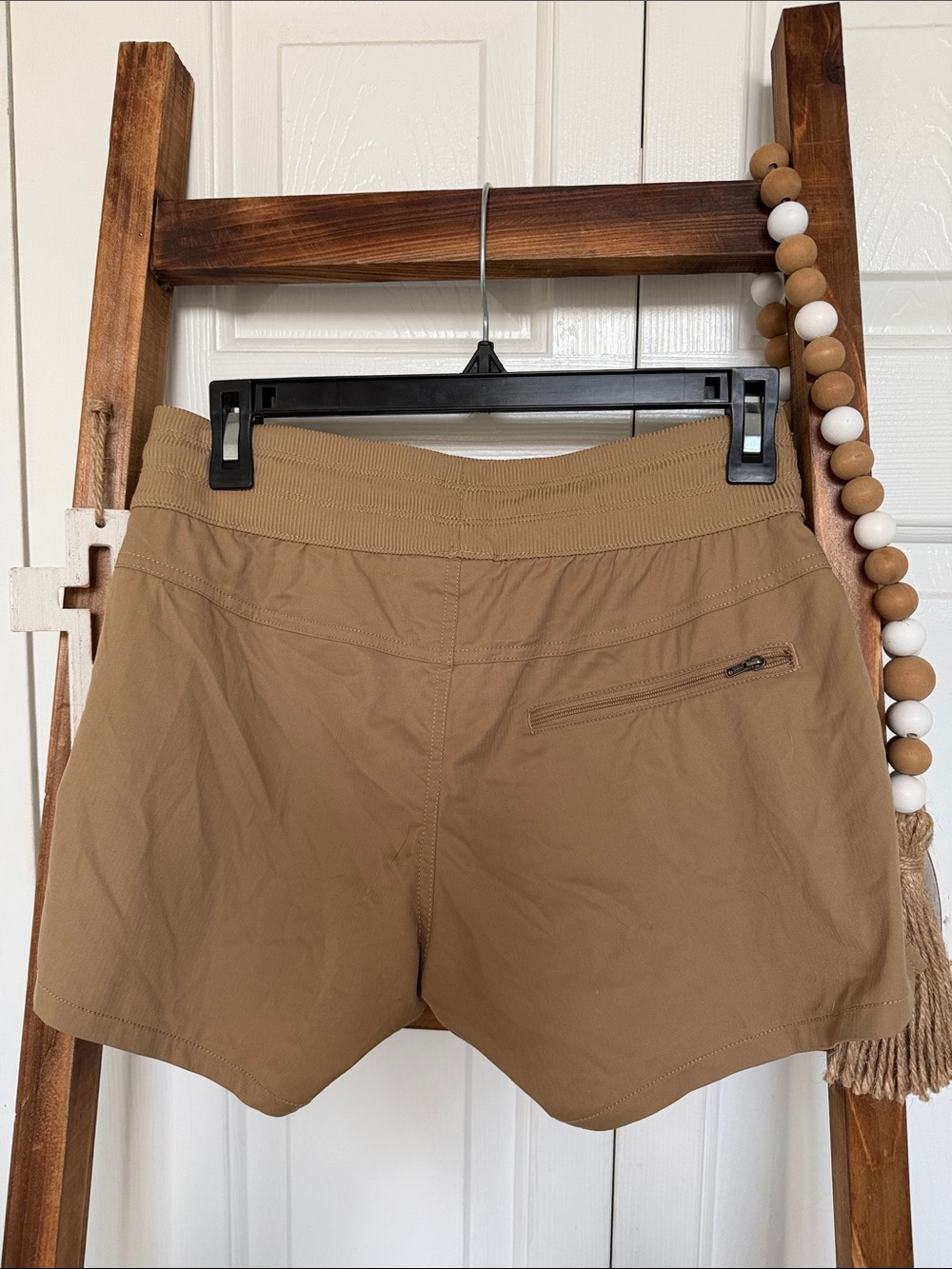 The North Face Women’s Tan Active Shorts. Pockets - Picture 4 of 4